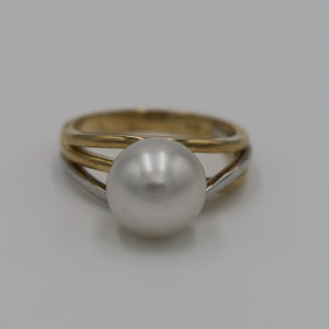 Lucinda is our stunning Australian South Sea pearl ring This ring is set in a two tone setting of 9ct White Gold and 9ct Yellow Gold.  It features a Round shape pearl, 10.3mm in size and White with a Silver hues in color, AAA grade  Size N (54)  J3100