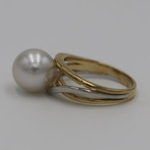 Load image into Gallery viewer, Lucinda is our stunning Australian South Sea pearl ring This ring is set in a two tone setting of 9ct White Gold and 9ct Yellow Gold.  It features a Round shape pearl, 10.3mm in size and White with a Silver hues in color, AAA grade  Size N (54)  J3100
