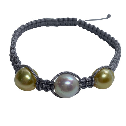 Macrame bracelet (thick thread grey) featuring an Australian (Broome) South Sea Pearl, Drop in shape, 10mm and two Golden South Sea,  Circle Drop 10mm in size  This bracelet is made from water and colorfast nylon material for heavy duty wear and tear, features no glue and no metal parts