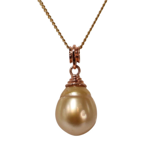 Indonesian South Sea pearl pendant featuring a Circle Drop shape, AAA grade pearl 12.1 x 14.7mm in size and Deep Gold in color. The pearl is set in 9ct Rose Gold pendant Chain included is Base metal only