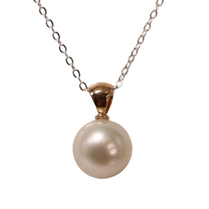 Australian South Sea pearl pendant featuring Round shape, AAA grade pearl 12.8mm in size and White with pink hues in color. The pearl is set in an 18ct Rose Gold pendant Chain included is Base metal only