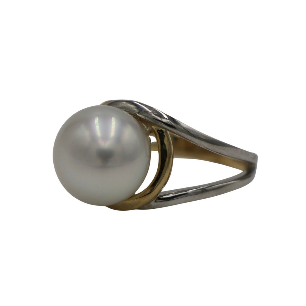 Australian South Sea pearl ring This ring is set in a two tone setting of 9ct White Gold and 9ct Yellow Gold. It features a Button shape pearl, 11.8mm in size and White with a Pink hues in color, AAA grade Size N (54)