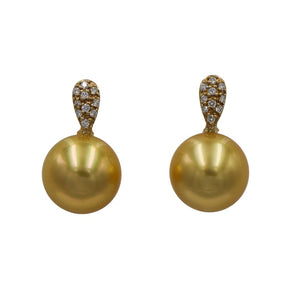 9ct Yellow gold and diamond stud style earrings in the shape of almonds and featuring TDW of 0.13ct and GSI quality They feature Indonesian South Sea Pearls, that are Round in shape and slightly under 11mm sizing in at 10.95mm They are Deep Gold in color with "AAA" lustre and skin